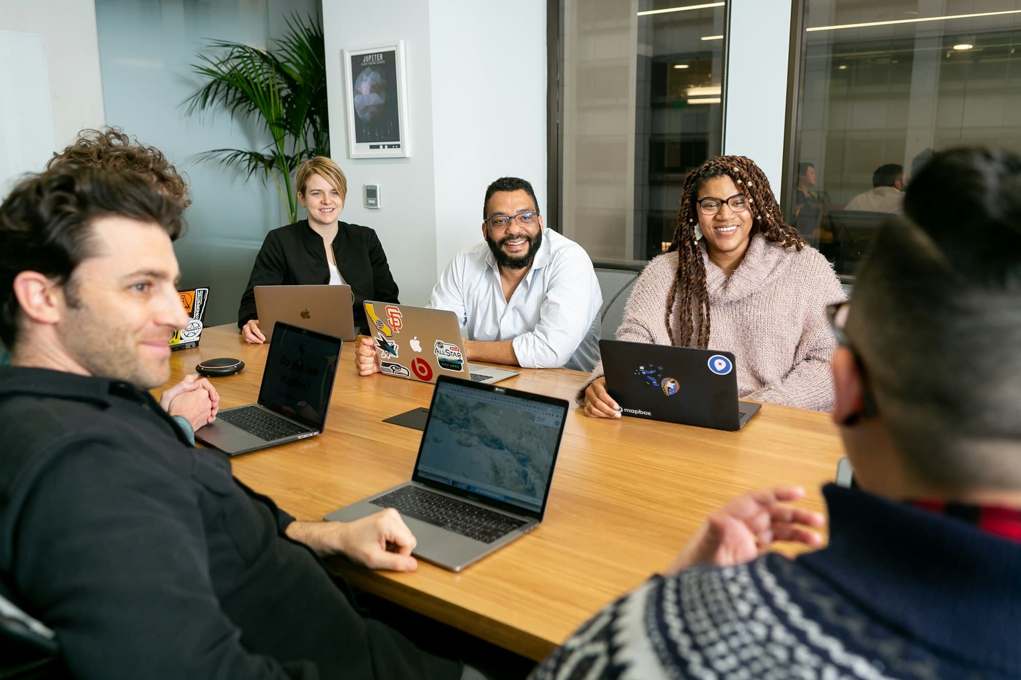 Leadership team in a board meeting discussing AI governance